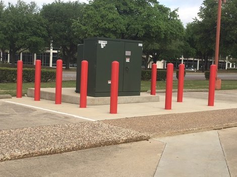 Red Bollards Protecting Utility